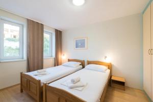 Postel nebo postele na pokoji v ubytování Hotel Rooms Roccia