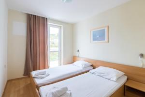 Postel nebo postele na pokoji v ubytování Hotel Rooms Roccia
