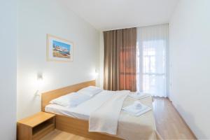 Postel nebo postele na pokoji v ubytování Hotel Rooms Roccia
