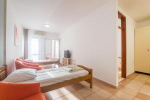 Postel nebo postele na pokoji v ubytování Hotel Rooms Roccia