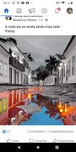 a picture of a puddle in a street at night at Chácara portal do dragão Suíte independente 1 in Paraty