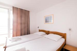 Postel nebo postele na pokoji v ubytování Hotel Rooms Roccia