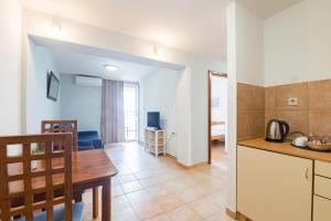 Kuchyň nebo kuchyňský kout v ubytování Hotel Rooms Roccia