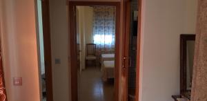 a hallway with a door leading to a room at The beach is close but quiet and not noisy Casa reformada cerca de la playa in San Pedro del Pinatar