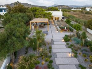 an overhead view of a garden with a stone walkway at Beachfront 3BR Villa Iremia in Naxos in Naxos Chora