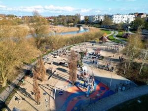 an aerial view of a park with a playground at Over the River in Iława