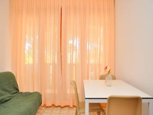 A seating area at Cozy flat with sunlit balcony retreat - Beahost