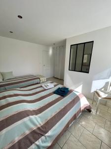 Łóżko lub łóżka w pokoju w obiekcie Chambres d'Hôtes Lefoulon