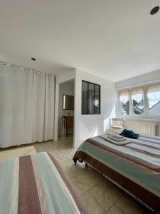 Łóżko lub łóżka w pokoju w obiekcie Chambres d'Hôtes Lefoulon