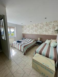 Łóżko lub łóżka w pokoju w obiekcie Chambres d'Hôtes Lefoulon