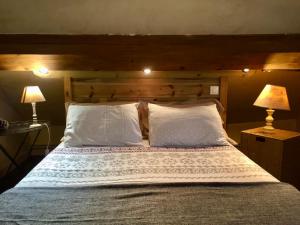 Łóżko lub łóżka w pokoju w obiekcie Chambres d'Hôtes Lefoulon
