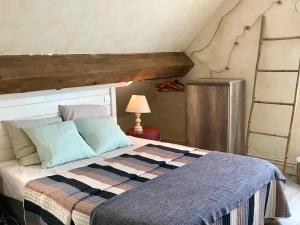 Łóżko lub łóżka w pokoju w obiekcie Chambres d'Hôtes Lefoulon