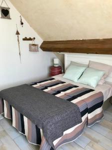 Łóżko lub łóżka w pokoju w obiekcie Chambres d'Hôtes Lefoulon