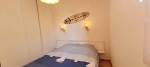 Ένα ή περισσότερα κρεβάτια σε δωμάτιο στο Appartement 2 chambres piscine