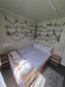 a bedroom with a bed in a tent at Бунгало РАФИ в къмпинг Атлиман - гр. Китен in Kiten