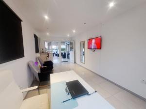 a living room with a laptop on a table at Florence Hotel Apartments in Ayia Napa