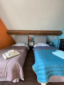 Łóżko lub łóżka w pokoju w obiekcie Chambres d'Hôtes Lefoulon