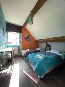 Łóżko lub łóżka w pokoju w obiekcie Chambres d'Hôtes Lefoulon