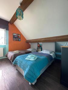 Łóżko lub łóżka w pokoju w obiekcie Chambres d'Hôtes Lefoulon