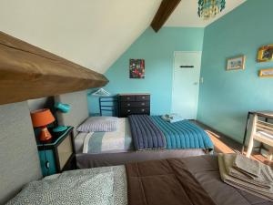 Łóżko lub łóżka w pokoju w obiekcie Chambres d'Hôtes Lefoulon