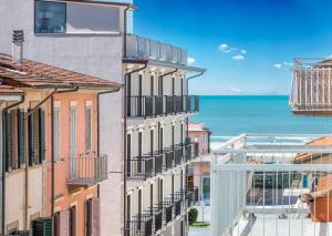 a view of the ocean from a building at Hotel Stella D'Italia in Viareggio