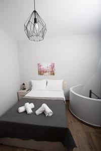 a bedroom with a bed and a bath tub at Lux Aprt in a Graphical Village in Kerásia