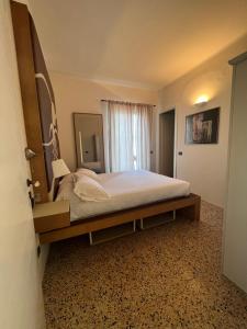 Postel nebo postele na pokoji v ubytování Locanda Lorena
