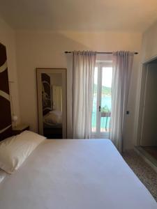 Postel nebo postele na pokoji v ubytování Locanda Lorena