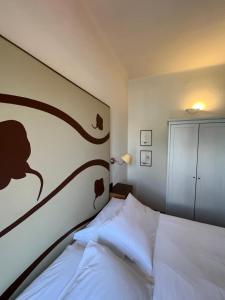 Postel nebo postele na pokoji v ubytování Locanda Lorena