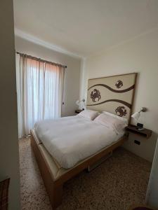 Postel nebo postele na pokoji v ubytování Locanda Lorena