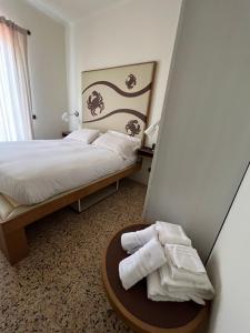 Postel nebo postele na pokoji v ubytování Locanda Lorena