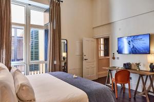 TV a/nebo společenská místnost v ubytování Puro Grand Hotel