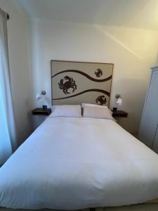 Postel nebo postele na pokoji v ubytování Locanda Lorena
