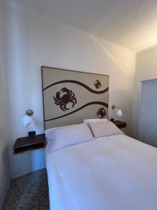 Postel nebo postele na pokoji v ubytování Locanda Lorena