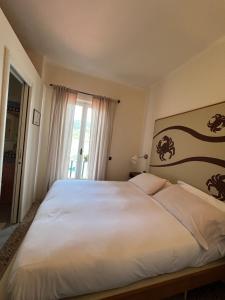 Postel nebo postele na pokoji v ubytování Locanda Lorena