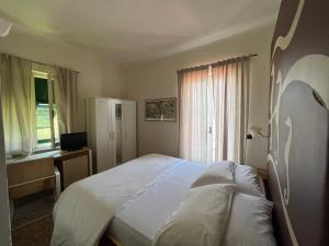Postel nebo postele na pokoji v ubytování Locanda Lorena