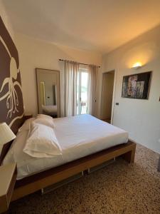Postel nebo postele na pokoji v ubytování Locanda Lorena