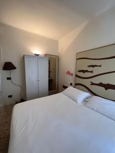 Postel nebo postele na pokoji v ubytování Locanda Lorena