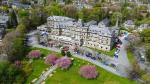 an aerial view of a large building in a city at The Palace Hotel Buxton & Spa in Buxton