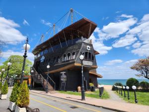 a pirate ship building on the side of a street at Golden Sands Apartments Zlatna Kotva in Golden Sands
