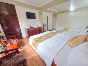Postel nebo postele na pokoji v ubytování Indochina Airport Hotel Ha Noi