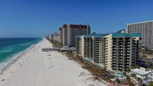 an aerial view of a beach with buildings and the ocean at Sunbird Sunsets in Panama City Beach