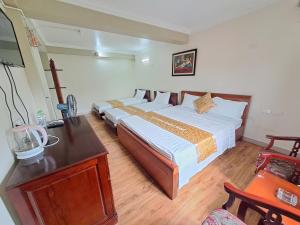 Postel nebo postele na pokoji v ubytování Indochina Airport Hotel Ha Noi