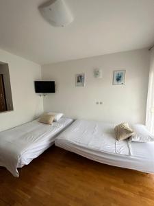 Ένα ή περισσότερα κρεβάτια σε δωμάτιο στο Apartment Bella with free parking