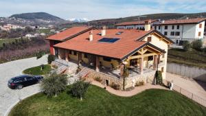 an aerial view of a house with a solar roof at La Collina dei Ciliegi in San Mauro di Saline