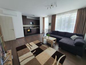 a living room with a couch and a table at Park West Apartment - Free Parking in Budapest