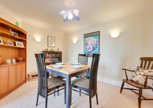 a dining room with a table and chairs at Flat 8 The Granary in Wells next the Sea