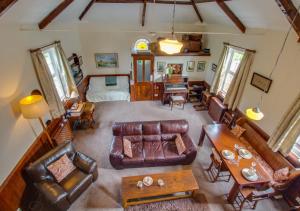 an overhead view of a living room with leather furniture at The Old Chapel in Banningham