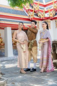 a group of people standing in front of a building at YAKTHAI POSHTEL in Bangkok