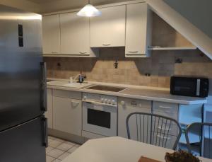 Kuchyň nebo kuchyňský kout v ubytování Monteursunterkunft Nidderau (20 km Hanau, 30 km Frankfurt) + 18 fotografií